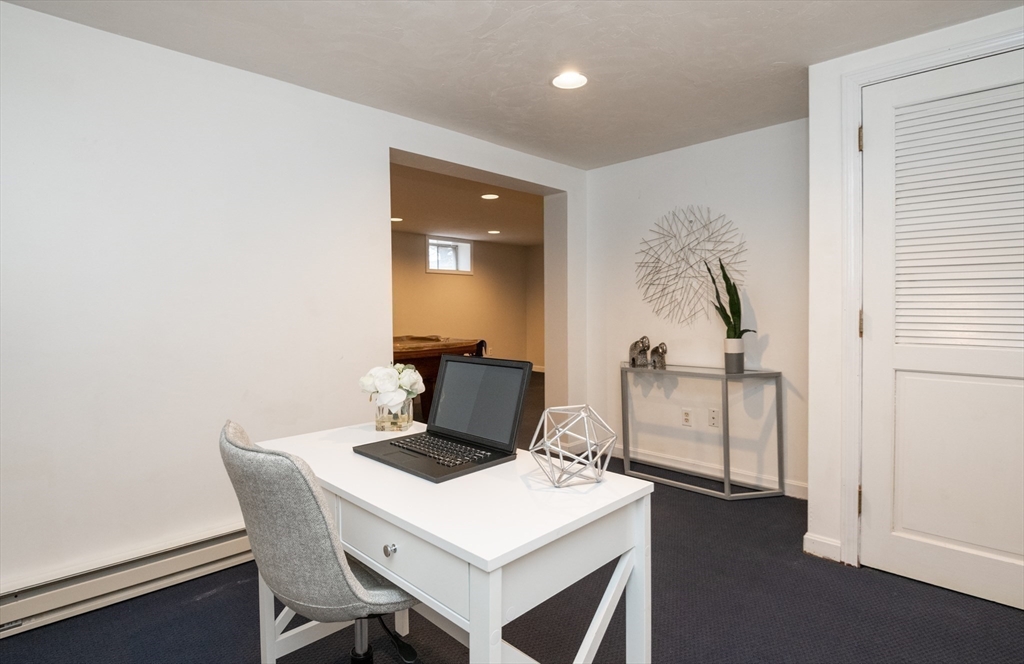 159 Willow Street Acton, MA 01720 - Photo 23 of 34 a view of a workspace with furniture and a window