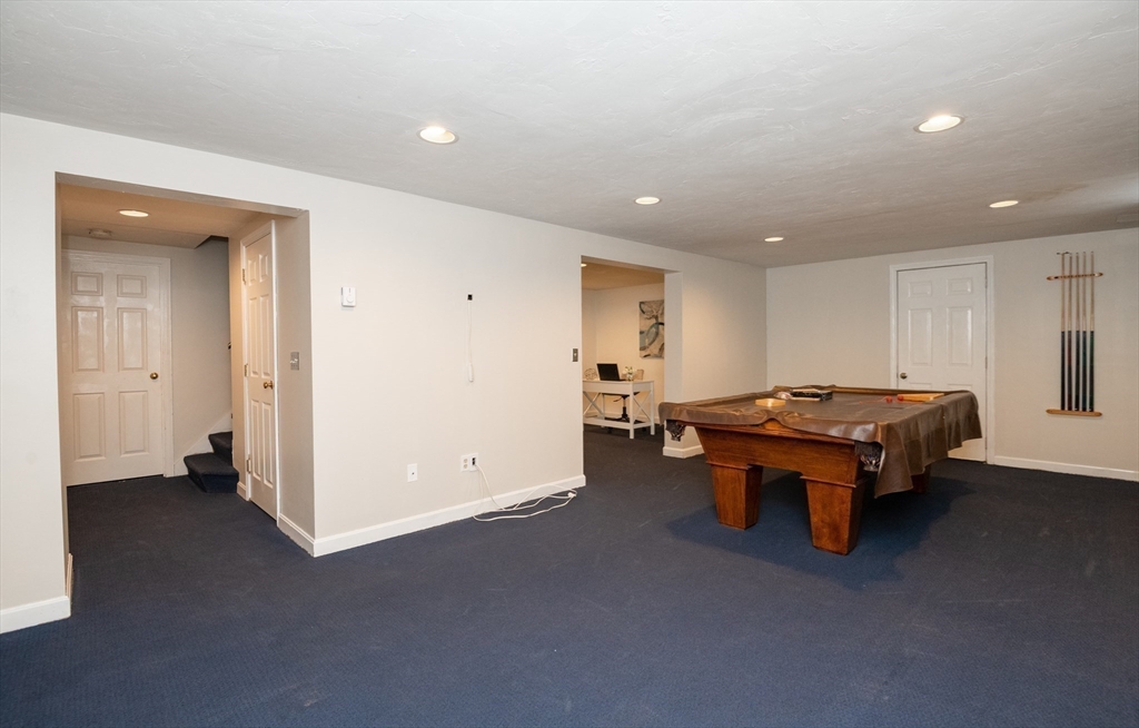 159 Willow Street Acton, MA 01720 - Photo 24 of 34 a living room with furniture pool table and a window