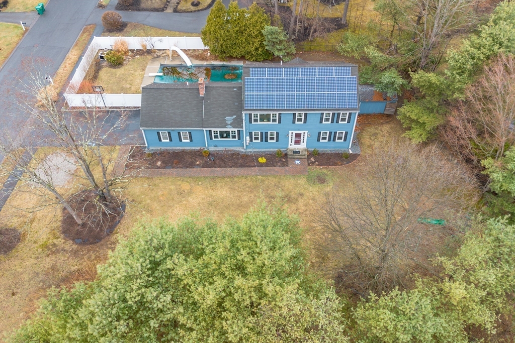 159 Willow Street Acton, MA 01720 - Photo 30 of 34 a view of a house with a yard and sitting area