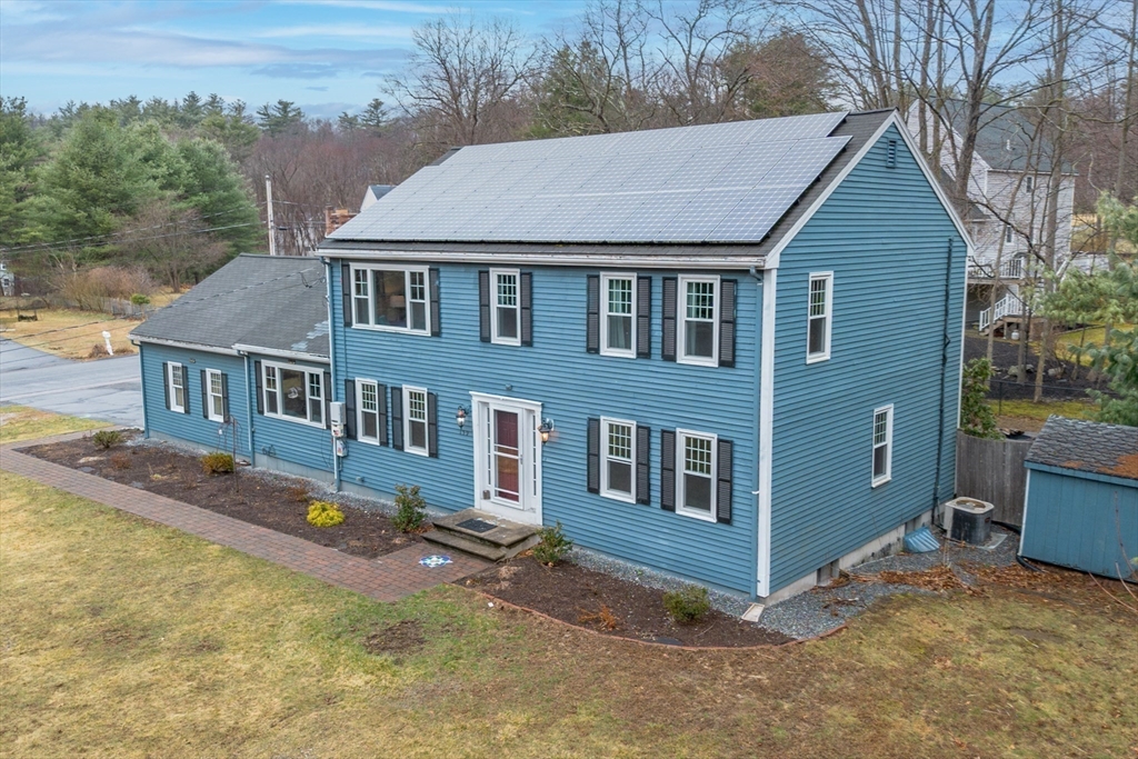 159 Willow Street Acton, MA 01720 - Photo 7 of 34 a aerial view of a house with a yard and sitting area