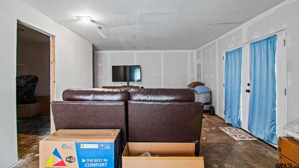 a living room with a couch and a flat screen tv