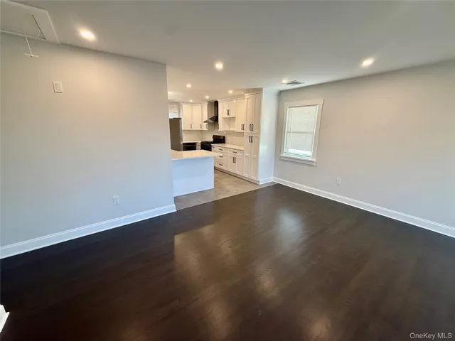 a large bed sitting in a bedroom and closet