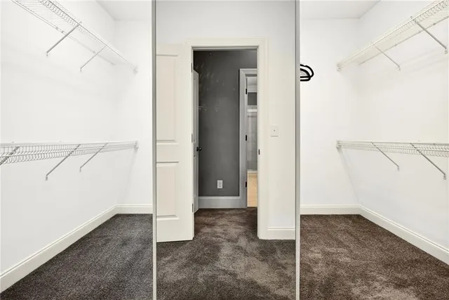 a view of a kitchen from a hallway