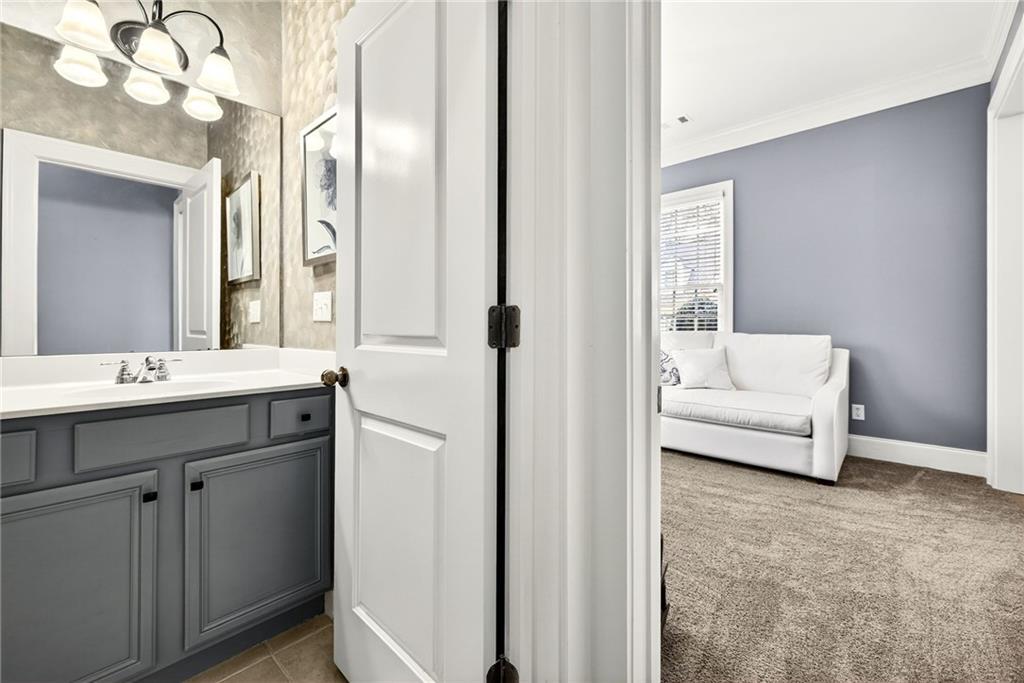 455 High Pointe Trail Roswell, GA 30076 - Photo 7 of 46 a en suite bathroom with a sink a mirror and a shower