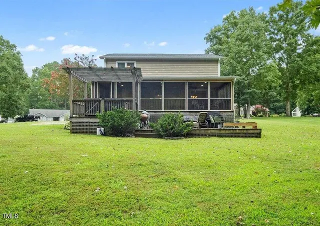 a backyard view with a seating space and garden