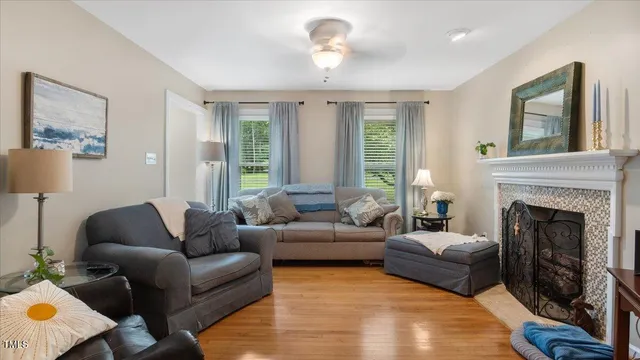 a living room with furniture and a fireplace