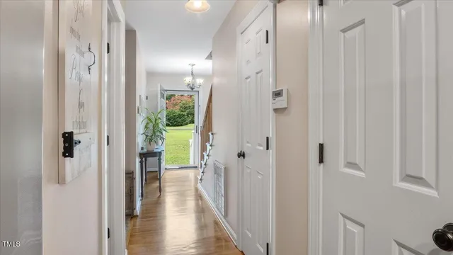 a view of a hallway with large glass door and closet