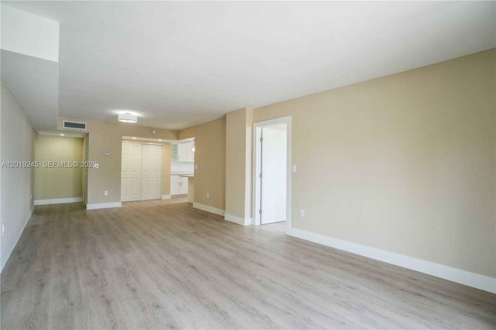 6960 Rue Vendome, Unit 201 Miami Beach, FL 33141 - Photo 3 of 27 a view of an empty room and wooden floor
