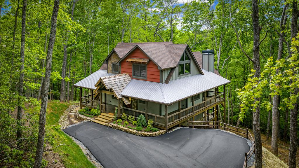 895 Price Road Blue Ridge, GA 30513 - Photo 125 of 140 an aerial view of a house with a yard table and chairs