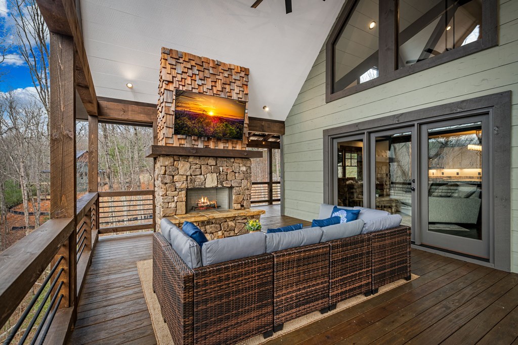 895 Price Road Blue Ridge, GA 30513 - Photo 16 of 140 a outdoor living space with furniture and a flat screen tv