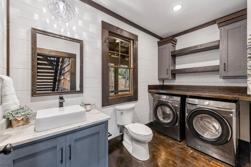 895 Price Road Blue Ridge, GA 30513 - Photo 21 of 140 a bathroom with a sink a washer and dryer
