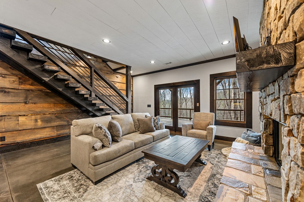 895 Price Road Blue Ridge, GA 30513 - Photo 39 of 140 a living room with furniture a fireplace and a flat screen tv