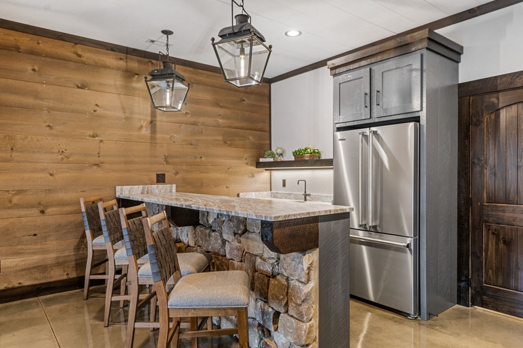 895 Price Road Blue Ridge, GA 30513 - Photo 43 of 140 a kitchen with stainless steel appliances a refrigerator and a table
