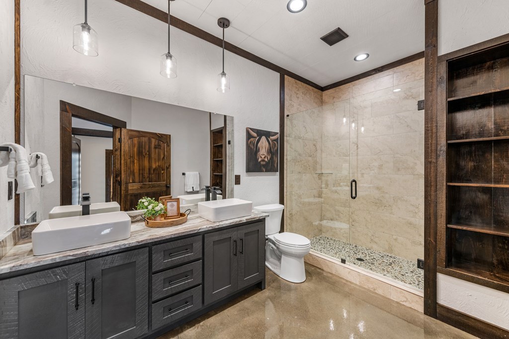 895 Price Road Blue Ridge, GA 30513 - Photo 53 of 140 a bathroom with a double vanity sink toilet mirror and shower
