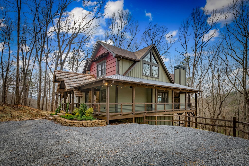 895 Price Road Blue Ridge, GA 30513 - Photo 99 of 140 a front view of a house with a garden