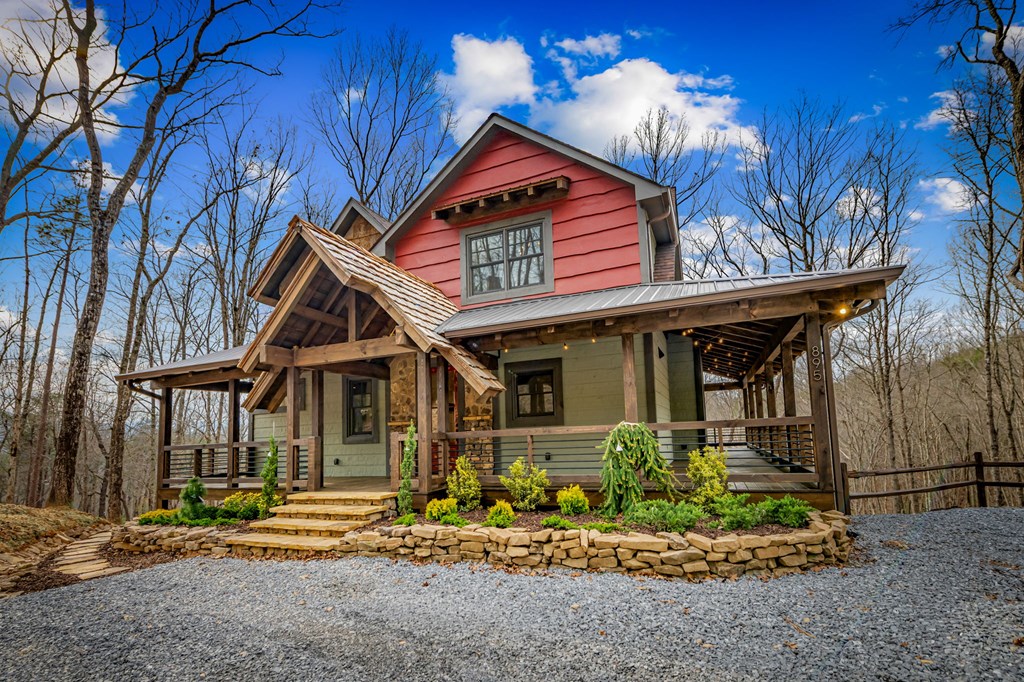 895 Price Road Blue Ridge, GA 30513 - Photo 100 of 140 a front view of a house with garden