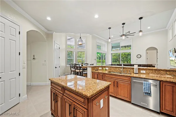a kitchen with stainless steel appliances granite countertop a sink and cabinets