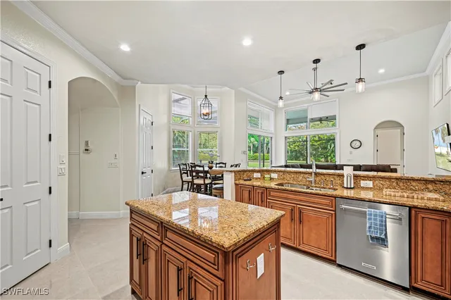 a kitchen with stainless steel appliances granite countertop a sink and cabinets