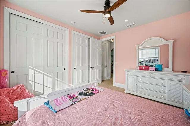 a bed room with a bed and a mirror