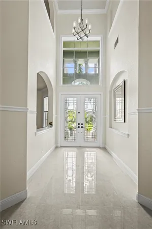 an empty room with windows and outdoor view