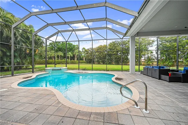 a view of a swimming pool with a patio