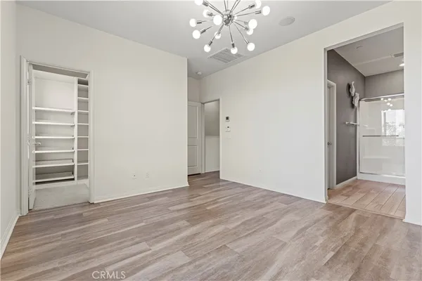 a bathroom with a sink a mirror a shower and vanity