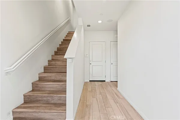a view of entryway with wooden floor