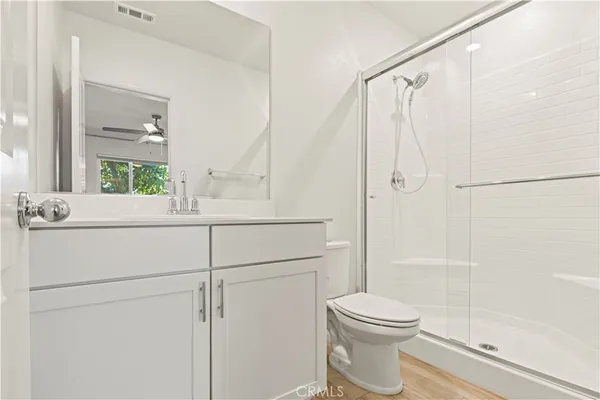 a bathroom with a toilet sink and shower