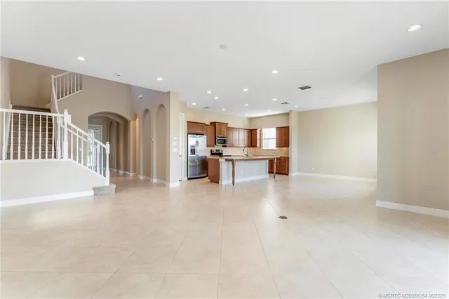 a view of a kitchen with a sink and an open kitchen view
