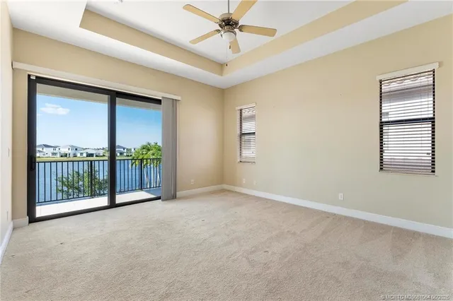 a view of a room with a large window and pool table