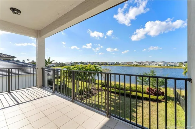 a view of a house with a swimming pool and a yard