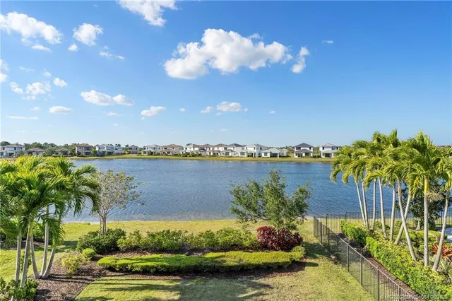 a large white kitchen with a sink