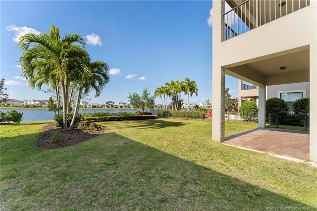 a view of a swimming pool with an outdoor space and seating area
