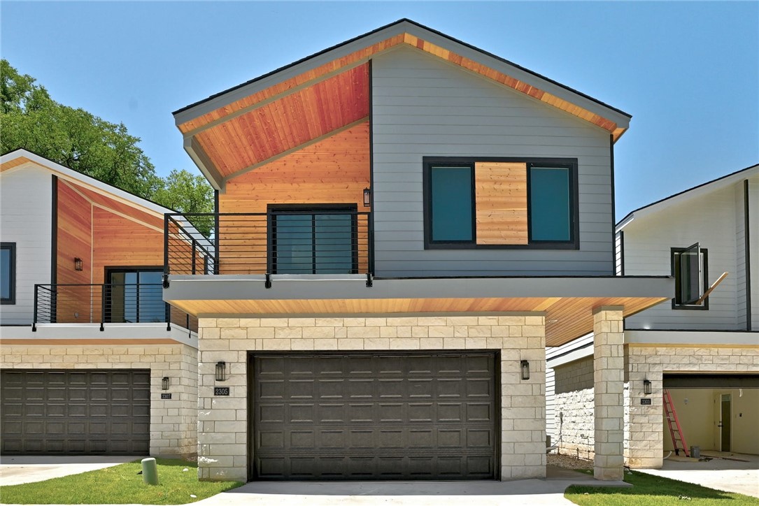 a front view of a house with a garage