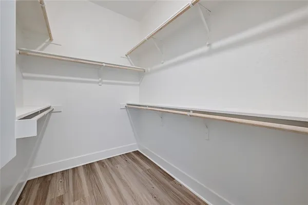 a view of an empty walk in closet