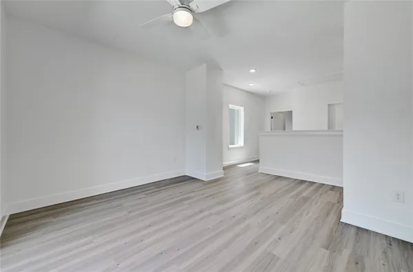 a view of a livingroom with wooden floor