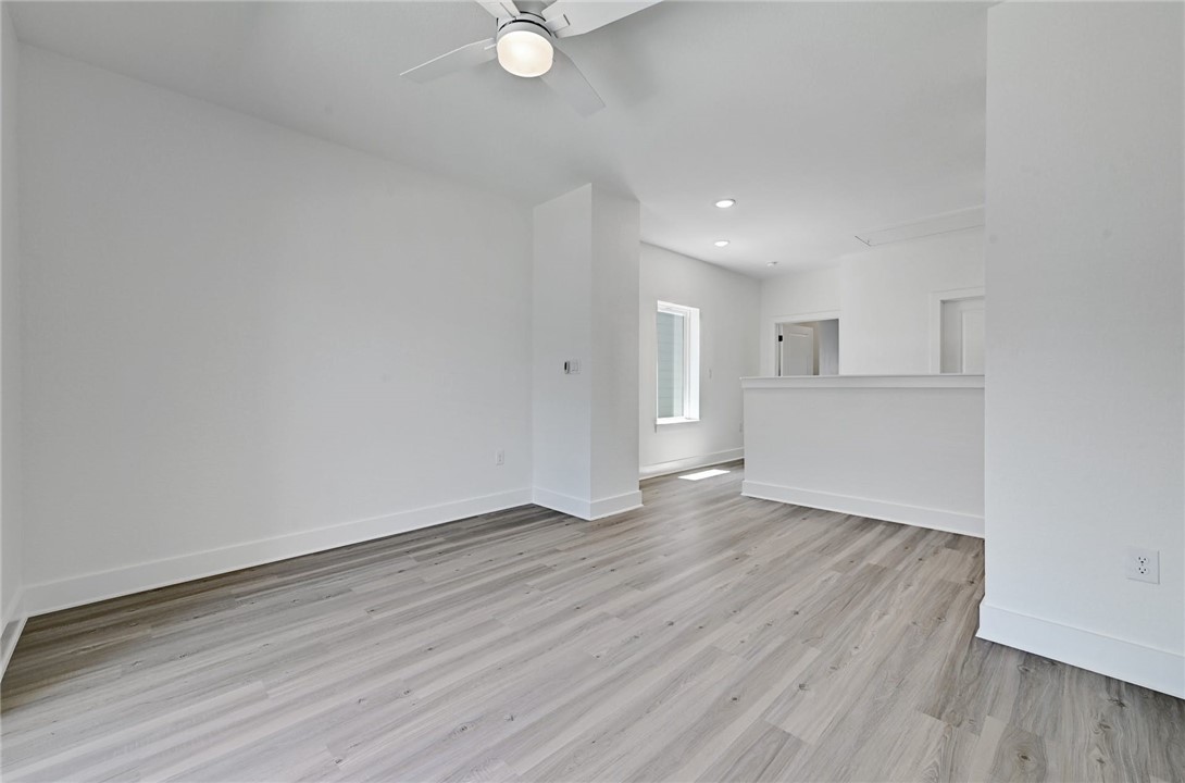 2305 Century Tree Cove Austin, TX 78723 - Photo 13 of 22 a view of a livingroom with wooden floor