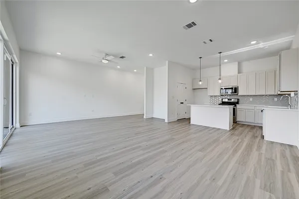a view of kitchen with wooden floor