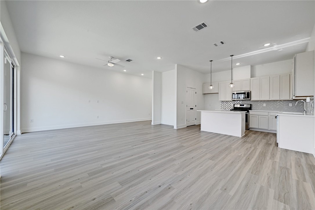 2305 Century Tree Cove Austin, TX 78723 - Photo 4 of 22 a view of kitchen with wooden floor