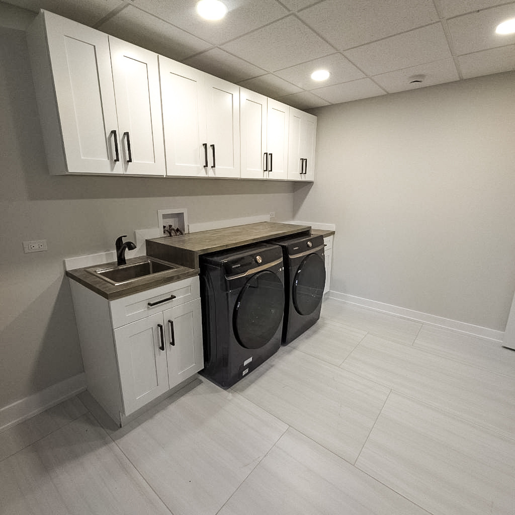 9517 Forest Place Des Plaines, IL 60016 - Photo 13 of 14 a kitchen with granite countertop a stove sink and cabinets