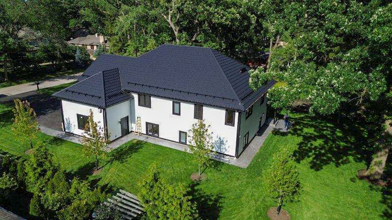9517 Forest Place Des Plaines, IL 60016 - Photo 14 of 14 a aerial view of a house with table and chairs under an umbrella