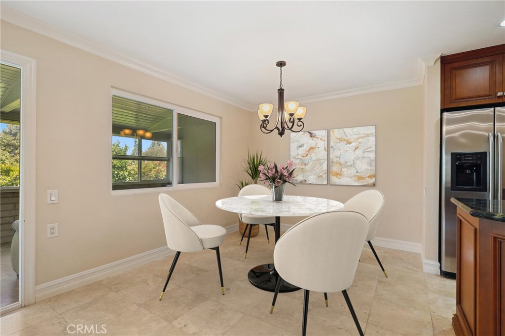 3413 Punta Alta, Unit A Laguna Woods, CA 92637 - Photo 13 of 45 a view of a dining room with furniture window and outside view