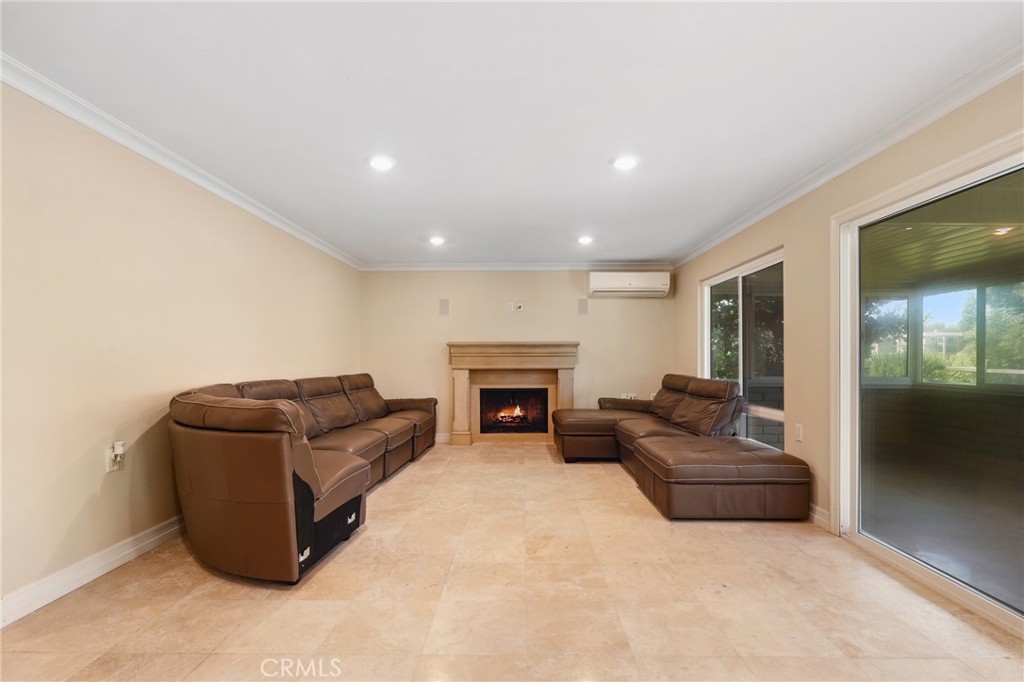 3413 Punta Alta, Unit A Laguna Woods, CA 92637 - Photo 16 of 45 a living room with furniture and a fireplace