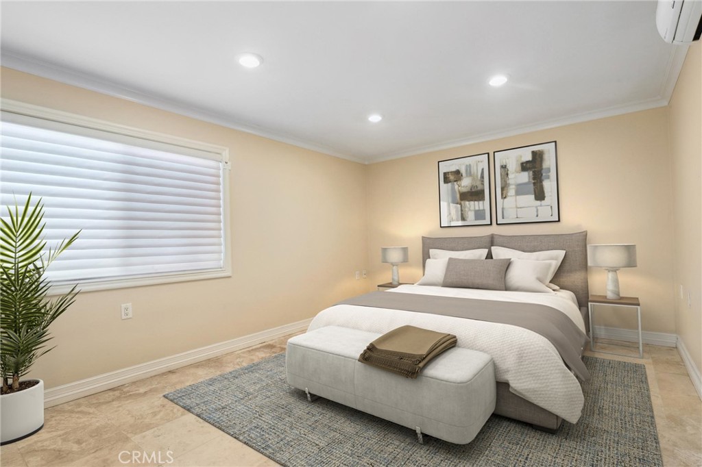 3413 Punta Alta, Unit A Laguna Woods, CA 92637 - Photo 19 of 45 a spacious bedroom with a bed and a potted plant