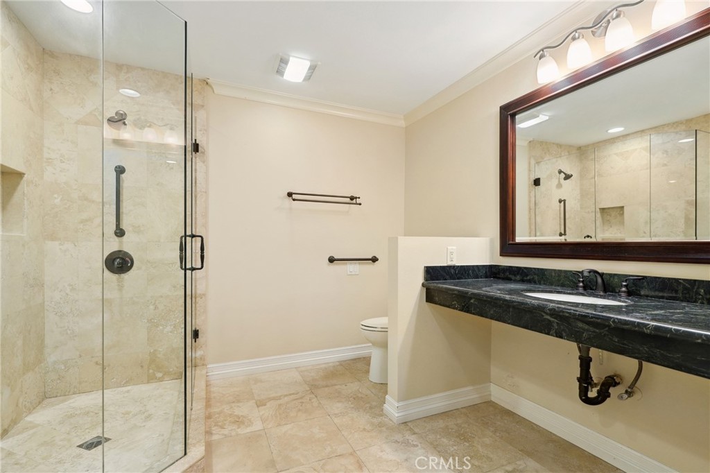 3413 Punta Alta, Unit A Laguna Woods, CA 92637 - Photo 26 of 45 a bathroom with a sink and a mirror