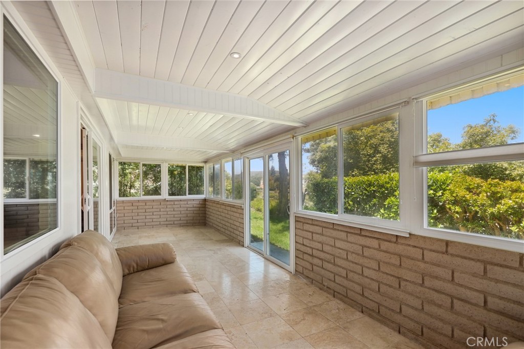 3413 Punta Alta, Unit A Laguna Woods, CA 92637 - Photo 30 of 45 a living room with furniture and a large window