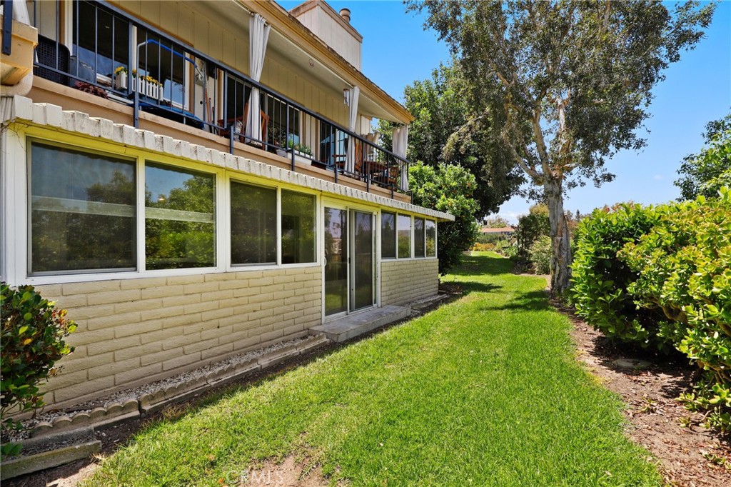 3413 Punta Alta, Unit A Laguna Woods, CA 92637 - Photo 31 of 45 a view of house with a yard