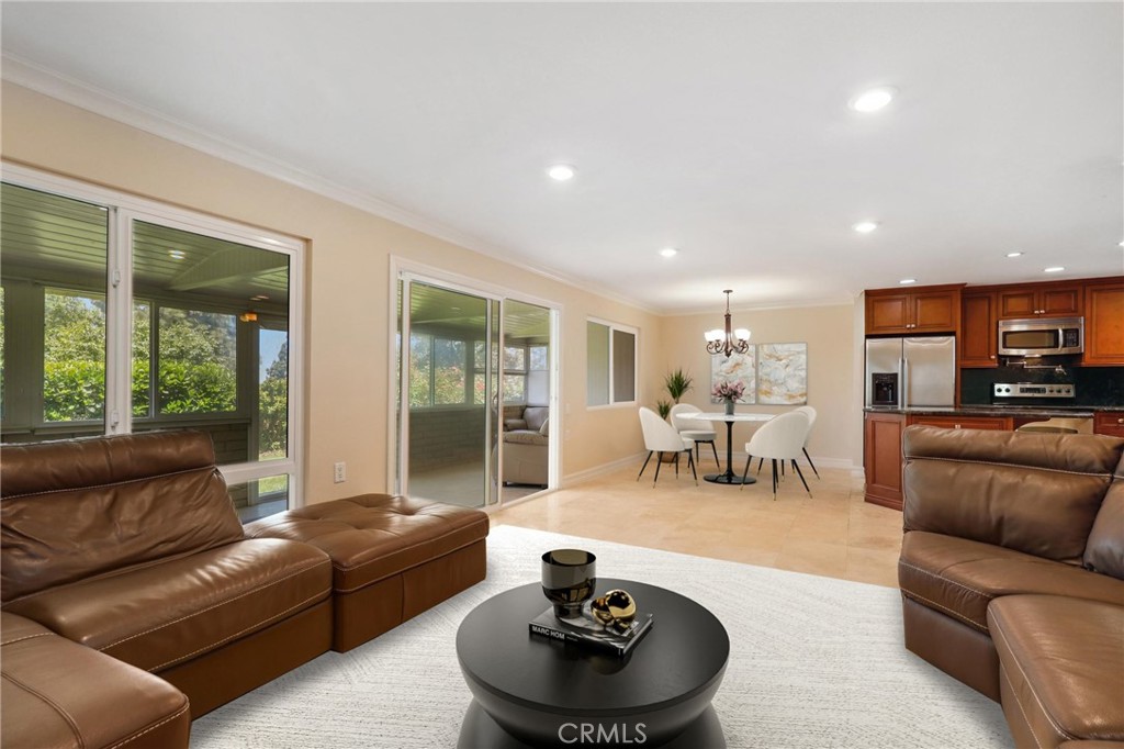 3413 Punta Alta, Unit A Laguna Woods, CA 92637 - Photo 6 of 45 a living room with furniture and a large window