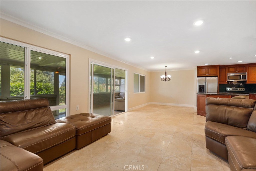 3413 Punta Alta, Unit A Laguna Woods, CA 92637 - Photo 7 of 45 a living room with furniture and a large window