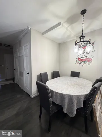 a view of a room with furniture and wooden floor